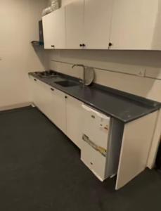 a kitchen with a sink and a counter top at موتيل رويا in Erbil