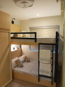 a room with two bunk beds with towels on them at Luxury Villa by Andres in San Juan +35 photos