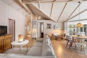 a living room with a couch and a table at M402-Vaeggerlose-Stolt-Henriksvej-93 in Bøtø By