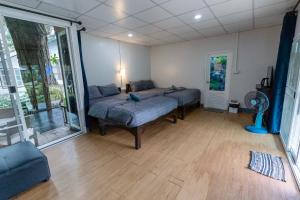 a room with two beds and a fan in it at อินทนนท์ขุนเล่าลือ in Ban Na Yang +15 photos