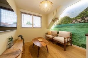 a room with a table and a chair and a window at Air Nomad • Bali in Valenciennes