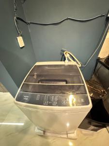 a close up of a toilet on display in a room at Moonlit Cinema Suite in Lahore