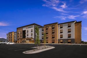 a rendering of a hotel with a parking lot at LivAway Suites Phoenix Tolleson in Phoenix