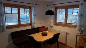 a living room with a table and a couch at Appartment Shelley in Vandans
