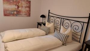 two beds sitting next to each other in a bedroom at Appartment Shelley in Vandans