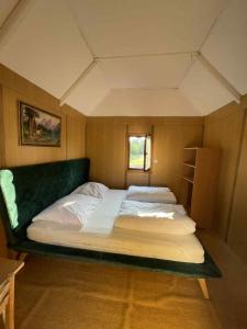 a bedroom with a large bed in a room at Kemp Karvánky in Dráchov +66 photos