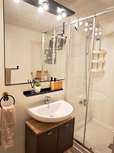 a bathroom with a sink and a shower at Bellavista Basement in Costa Del Silencio +21 photos