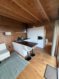 a kitchen with a large island in a room at Sunset Eco Shelter 4 in Ponta do Pargo