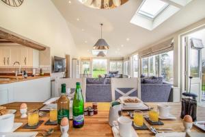 a kitchen and living room with a wooden table at 2 Bed in Heveningham oc-w29034 in Heveningham