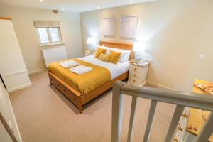 a bedroom with a bed with yellow sheets and yellow pillows at 2 Bed in Heveningham oc-w29034 in Heveningham