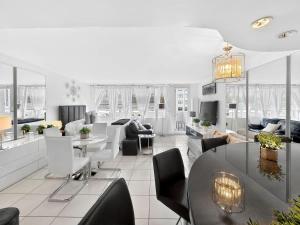 a living room with a table and chairs at Miami Beach Studio with shared Heated Pool & Gym in Miami Beach