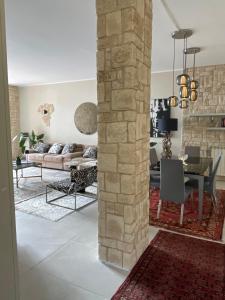 a living room with a couch and a table at Casa Della Baia With a beautiful view in Varazze