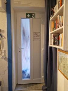 a door with a window in a room at Ferienwohnung Seesternchen am Deich2 C46 in Norden +24 photos