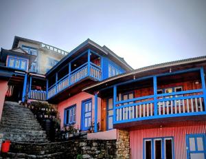 a large house with blue and red at Sagun's Place in Phāphlu
