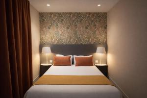 Postel nebo postele na pokoji v ubytování Parici Hôtel Boulogne Billancourt