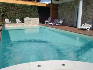 The swimming pool at or close to Residence Rivachiara (check-in at Hotel Riviera in Viale Rovereto, 95)