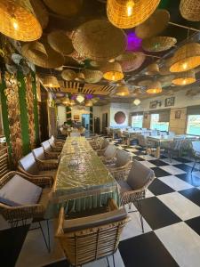 a large dining room with a long table and chairs at pearl green's in Anandpur Sāhib