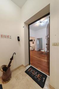 a room with a door with a sign that says love at Ele Home in Siena