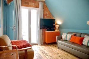 a living room with a couch and a window at Haus-Selma in Lüneburg