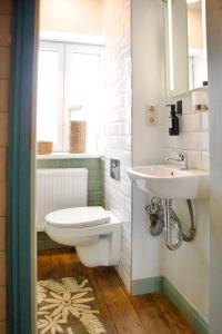 a bathroom with a toilet and a sink at Haus-Selma in Lüneburg +61 photos