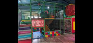 a play room with a bunch of play equipment at Seaside Arizona in Morecambe