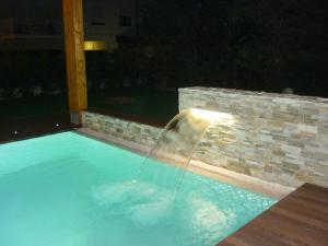 The swimming pool at or close to Residence Rivachiara (check-in at Hotel Riviera in Viale Rovereto, 95)