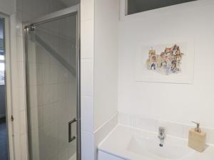 a bathroom with a sink and a shower at 3 Leycester Court in Warwick +22 photos