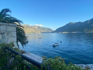 a view of a lake with a boat in the water at Boka Bay Beach House in Dražin Vrt