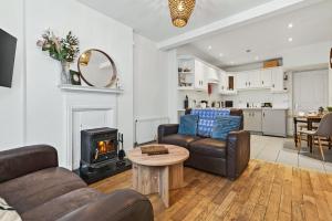 a living room with a couch and a stove at Wolfe Tone Apartment in Sligo