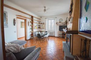 a living room with a couch and a table at Casa Emi in Lezzeno +20 photos