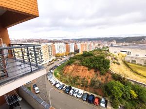 arial view of a city with cars parked in a parking lot at Colinas do Cruzeiro Residence Odivelas in Odivelas