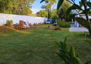 a park with benches sitting in the grass at Ramallo es Bienestar 8 plazas in Ramallo