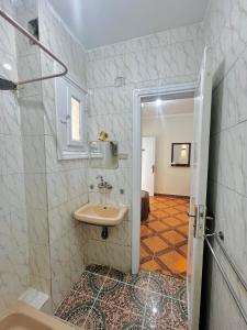 a bathroom with a sink and a shower at Keylany Hotel Aswan in Aswan +90 photos