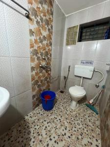 a bathroom with a toilet and a bucket in it at The Wilderness Studio! in Anjuna +14 photos