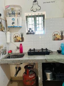 a kitchen with a sink and a counter top at The Wilderness Studio! in Anjuna