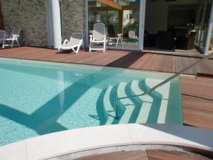 The swimming pool at or close to Residence Rivachiara (check-in at Hotel Riviera in Viale Rovereto, 95)