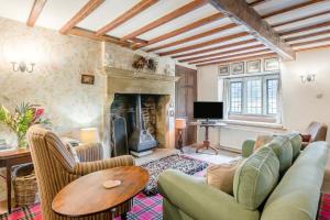 a living room with a couch and a fireplace at 2 Bed in Hawes oc-c33371 in Hawes