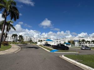 a street in front of a large apartment complex at Tropical Escape in Ceiba