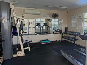 a gym with treadmills and a treadmill at Tropical Escape in Ceiba