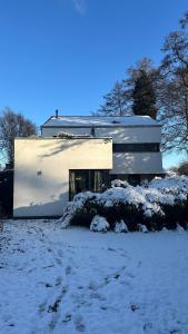 a white building with snow in front of it at FREIraum14 in Oldenburg