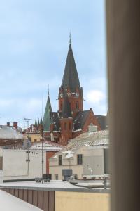 a view of a city with snowy roofs at Hotell Navet in Västervik