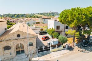 an overhead view of a small town with a church at Locanda Del Picchio in Loreto