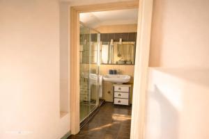 a bathroom with a sink and a mirror at The Central Milano in Milan +8 photos