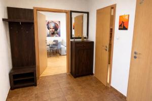 a hallway with a door leading to a living room at Apartmán MARKI in Malacky +77 photos