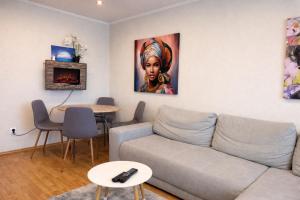 a living room with a couch and a table at Apartmán MARKI in Malacky