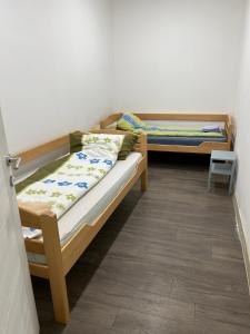 a room with two bunk beds in a room at Apartmani Centar in Sivac