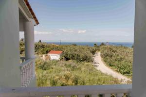 a view from a balcony of a house and a road at Villa Mika in Zakynthos