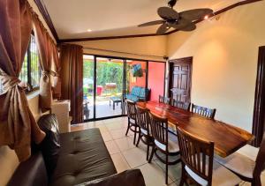 a dining room with a wooden table and chairs at Villa Noelia in El Jurón