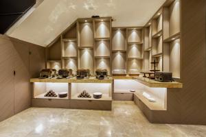 a kitchen with a counter with pots and pans at The Vanson Pride, Delhi Central Stay in New Delhi +49 photos