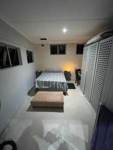 a bedroom with a bed in the middle of it at Mtunzini Rustic Retreat in Mtunzini +52 photos